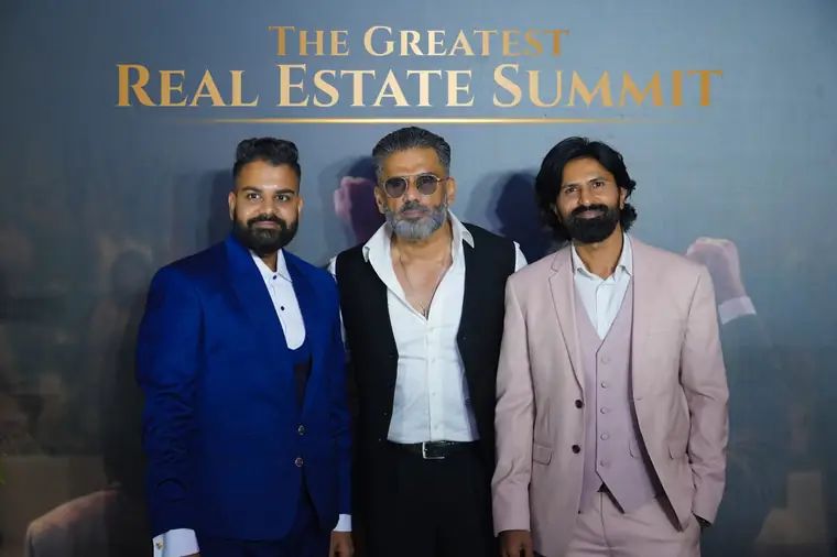 CA Mayur Mehta and Dev Gadhvi with guests at a previous summit