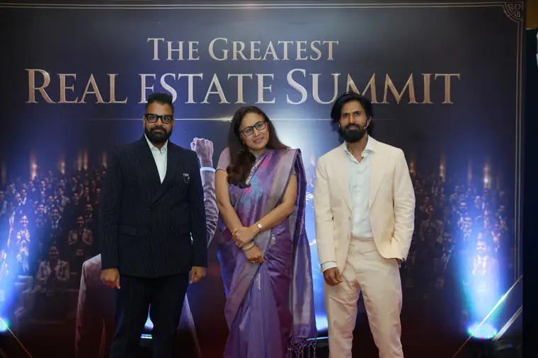 Dev Gadhvi and CA Mayur Mehta with a guest at a previous summit